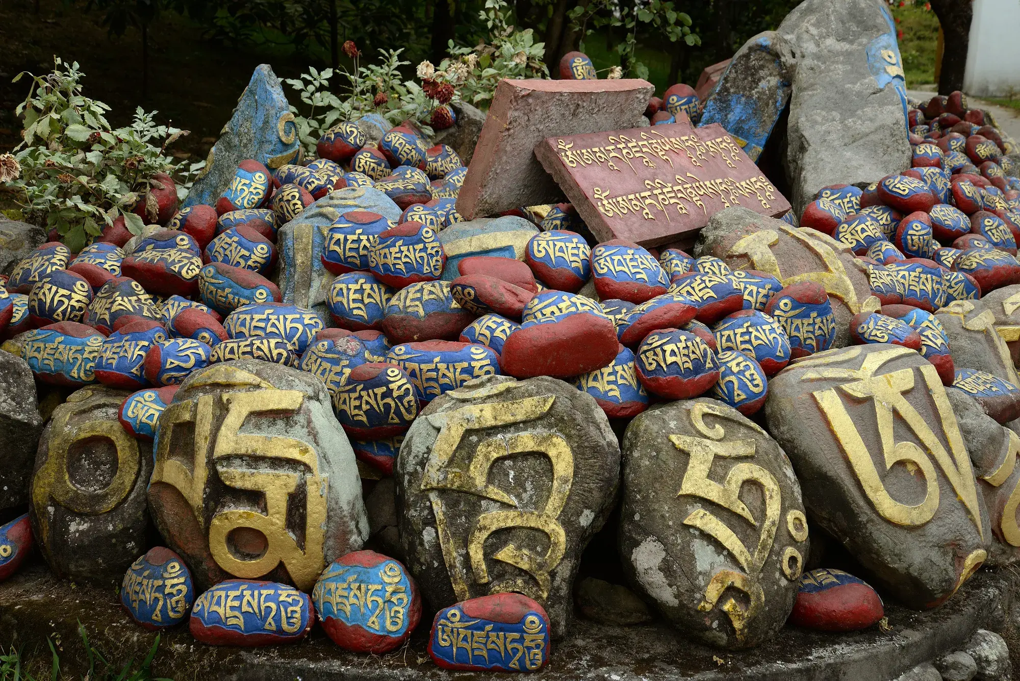 Mani stones carved and painted with mantras