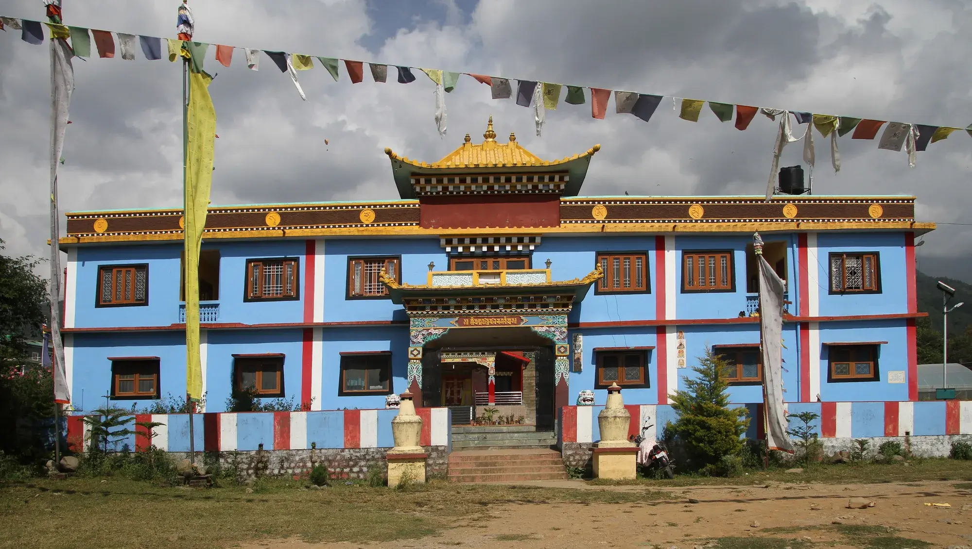 Prayer flags strung across a Bir monastery